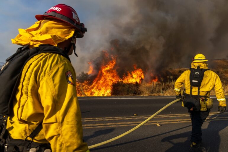 Firefighters trying to contain a wildfire in Riverside Country in southern California, July 2023. Image: Shutterstock