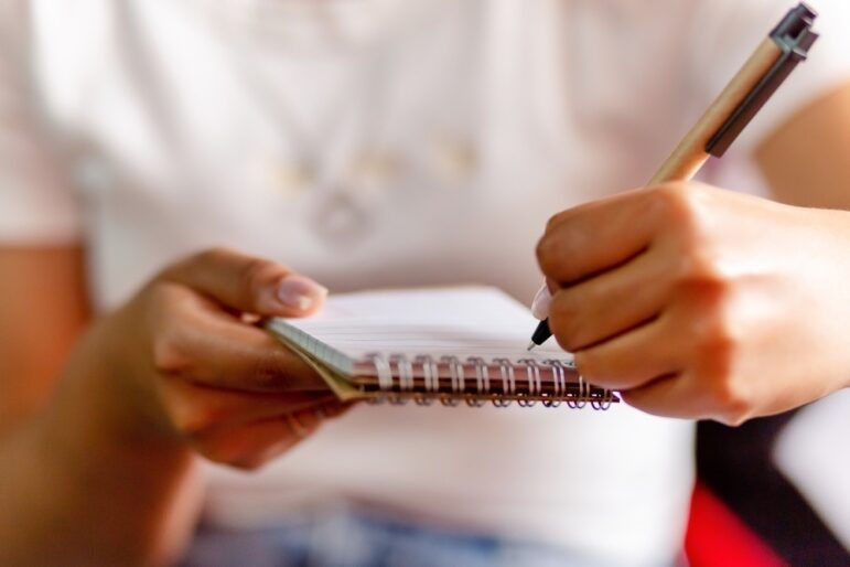 Student journalist, talking notes